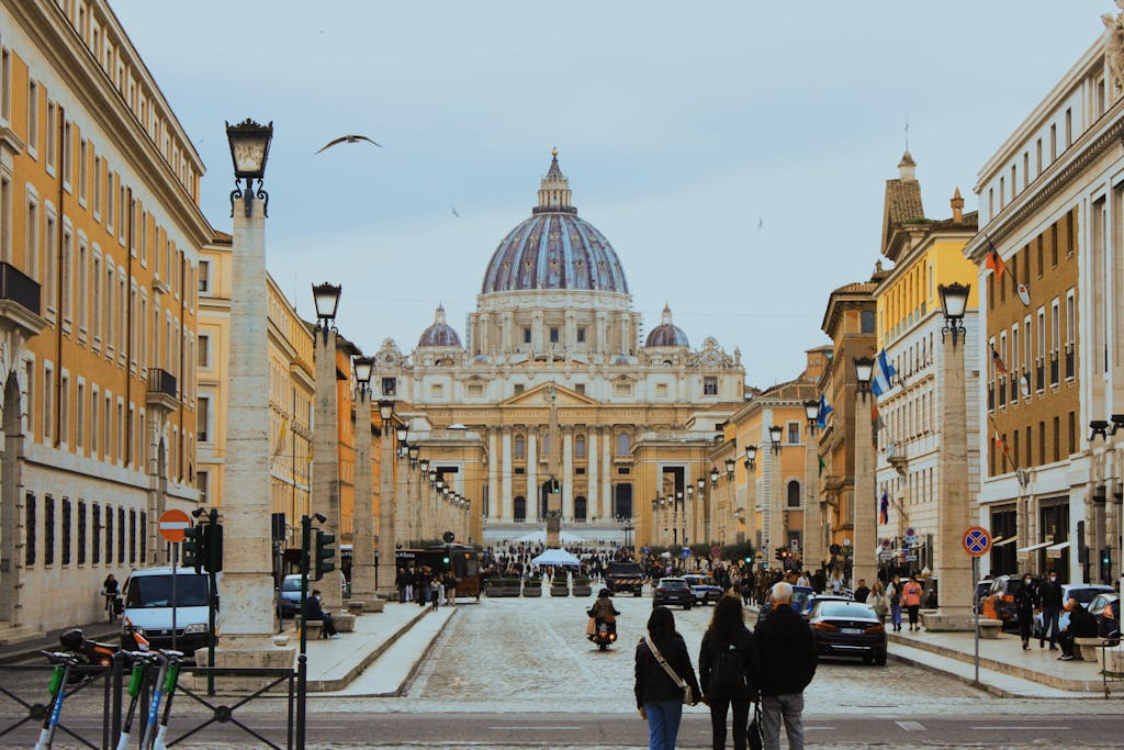 A captivating view of St. Peter's Basilica with bustling city life in Vatican City, Rome.